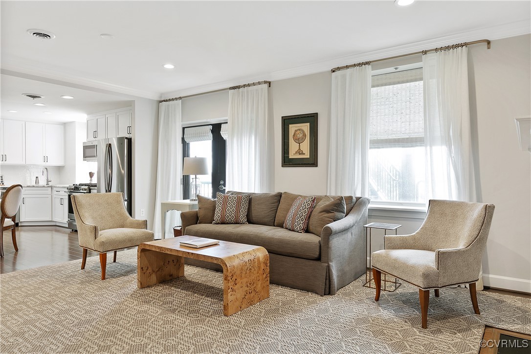 413 Stuart Circle, Unit 5E Richmond, VA 23220 - Photo 4 of 44 a living room with furniture and a large window
