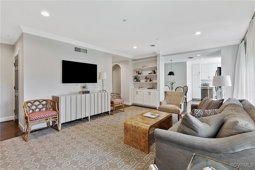413 Stuart Circle, Unit 5E Richmond, VA 23220 - Photo 5 of 44 a living room with furniture and a flat screen tv