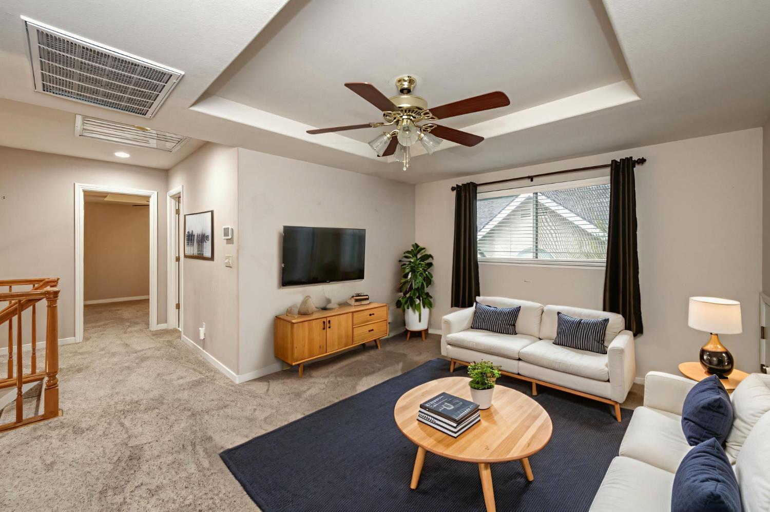 3014 West Brompton Lane Fresno, CA 93711 - Photo 25 of 71 Den/loft upstairs showing entrance to 3rd bedroom. Bathroom between loft and bedroom. Digitally furnished.