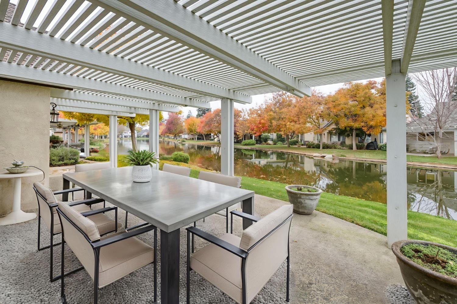 3014 West Brompton Lane Fresno, CA 93711 - Photo 55 of 71 Covered patio showing view of stream out back. Digitally furnished.