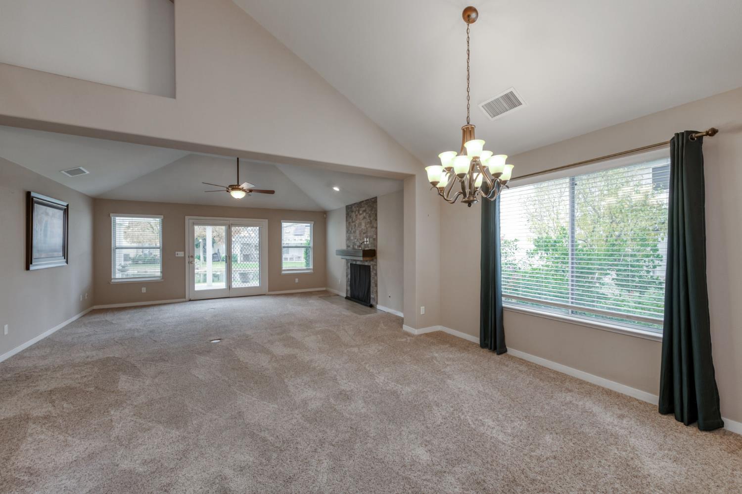 3014 West Brompton Lane Fresno, CA 93711 - Photo 8 of 71 Family and dining room. French door to patio and stream out back.