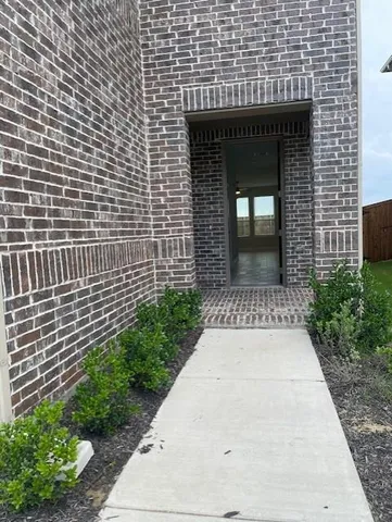 a stone house with a small yard