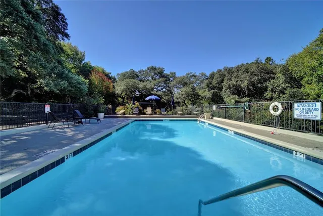 a view of a swimming pool with an outdoor seating