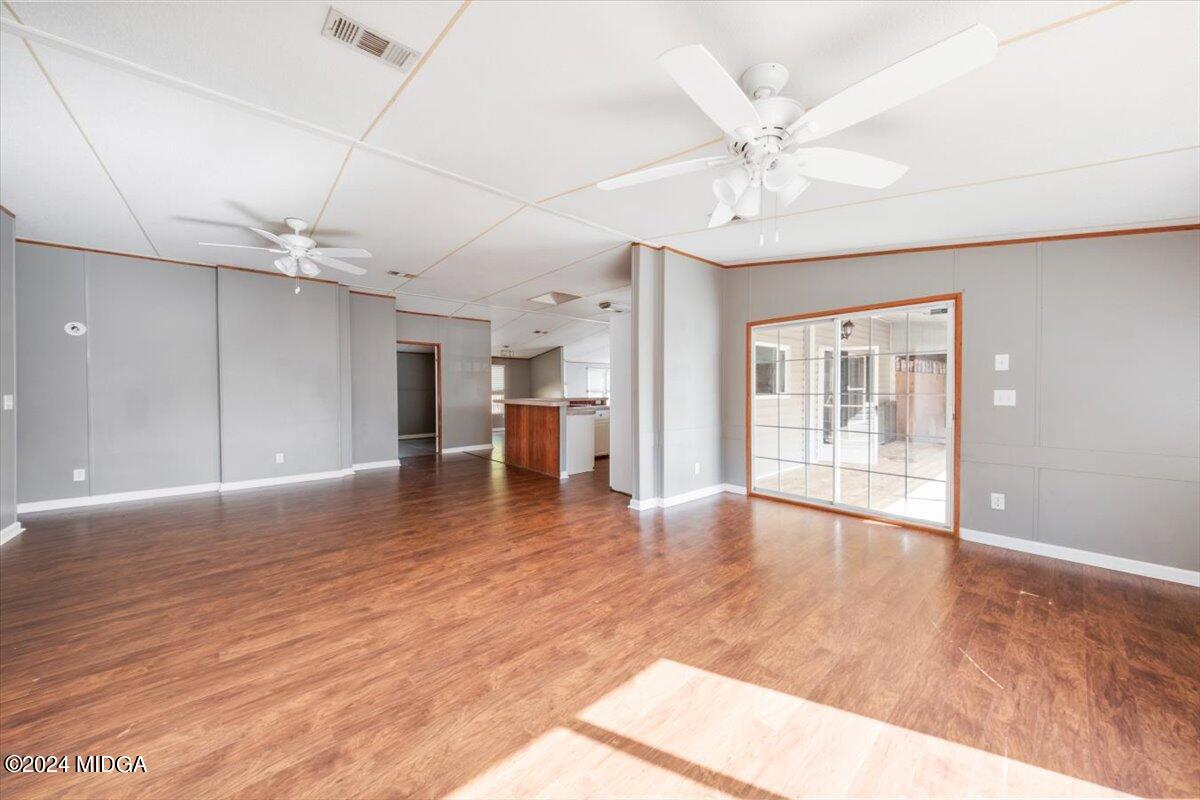 647 Gose Road Forsyth, GA 31029 - Photo 15 of 34 a view of an empty room with a window and wooden floor