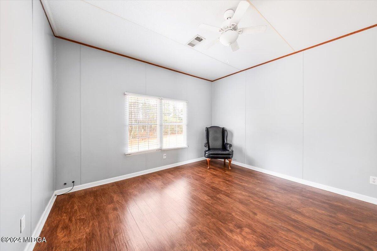 647 Gose Road Forsyth, GA 31029 - Photo 19 of 34 a view of room with window and wooden floor