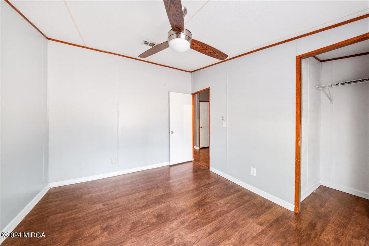 647 Gose Road Forsyth, GA 31029 - Photo 21 of 34 a view of an empty room with wooden floor