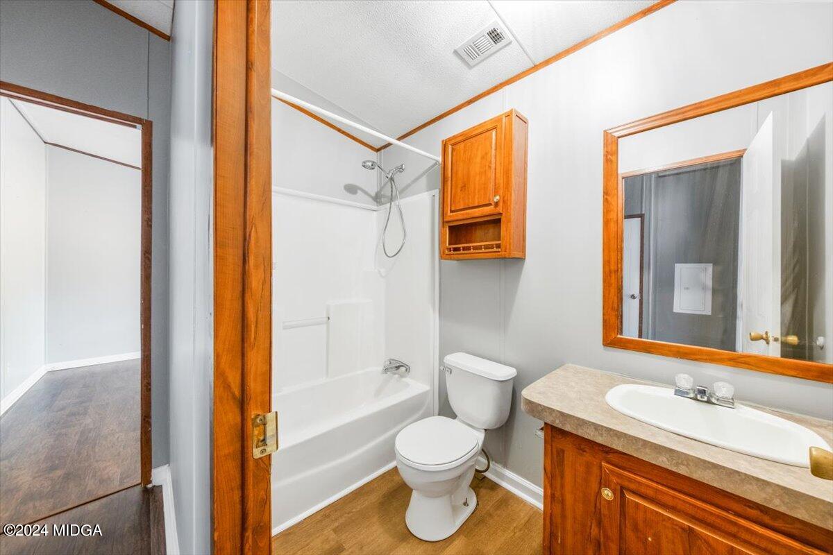 647 Gose Road Forsyth, GA 31029 - Photo 22 of 34 a bathroom with a granite countertop sink toilet and shower