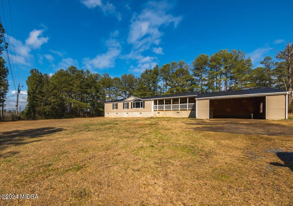 647 Gose Road Forsyth, GA 31029 - Photo 26 of 34 a front view of a house with a yard