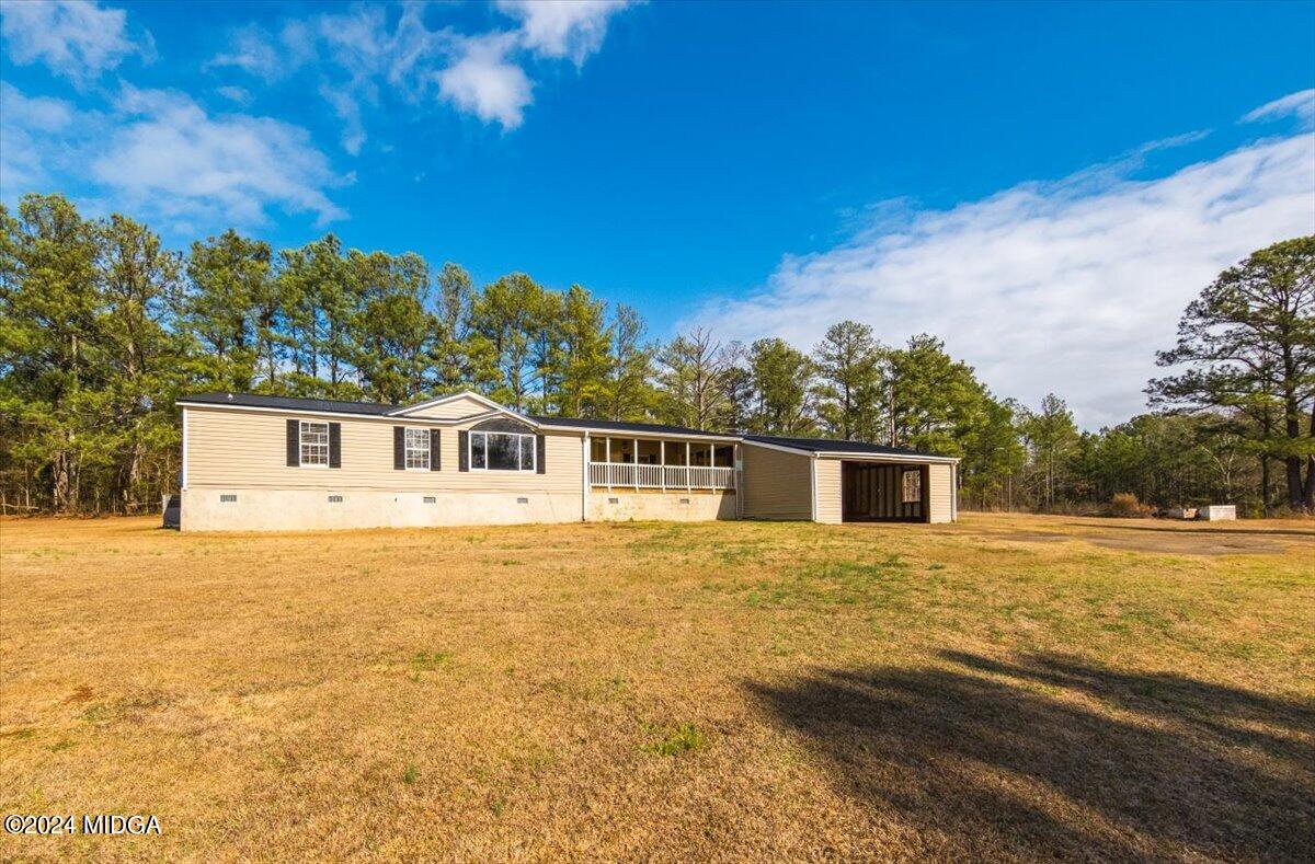 647 Gose Road Forsyth, GA 31029 - Photo 27 of 34 a front view of a house with a yard