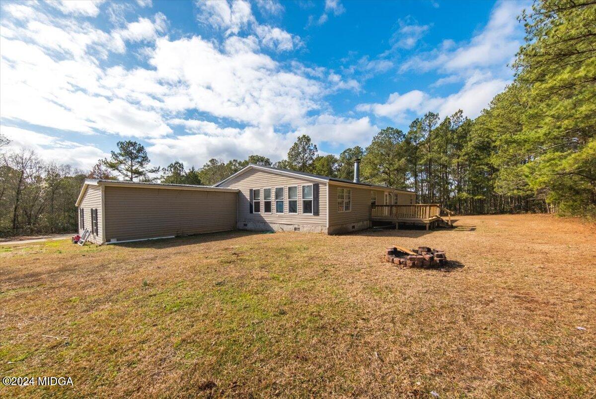 647 Gose Road Forsyth, GA 31029 - Photo 32 of 34 a view of a terrace with a barbeque