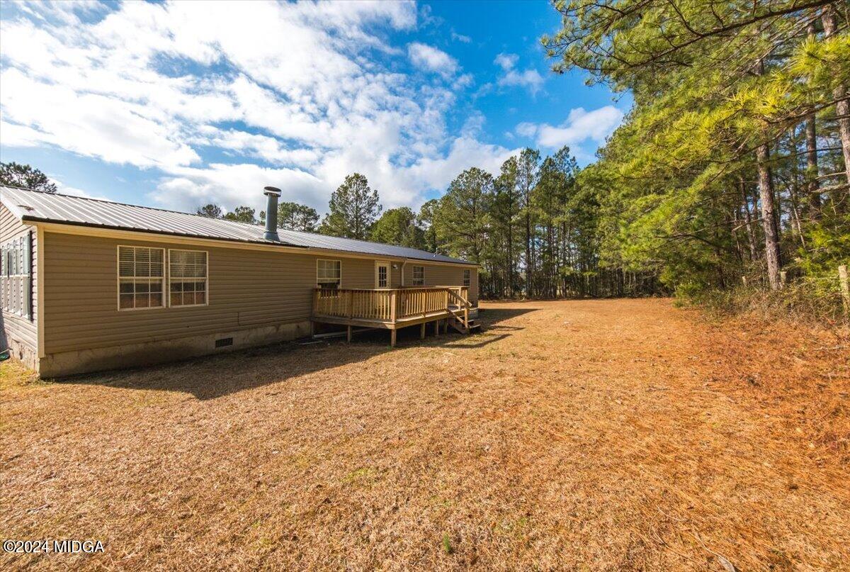 647 Gose Road Forsyth, GA 31029 - Photo 33 of 34 a front view of a house with a yard