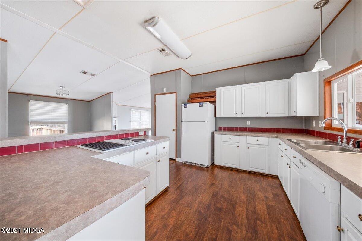 647 Gose Road Forsyth, GA 31029 - Photo 4 of 34 a kitchen with a sink stove and cabinets