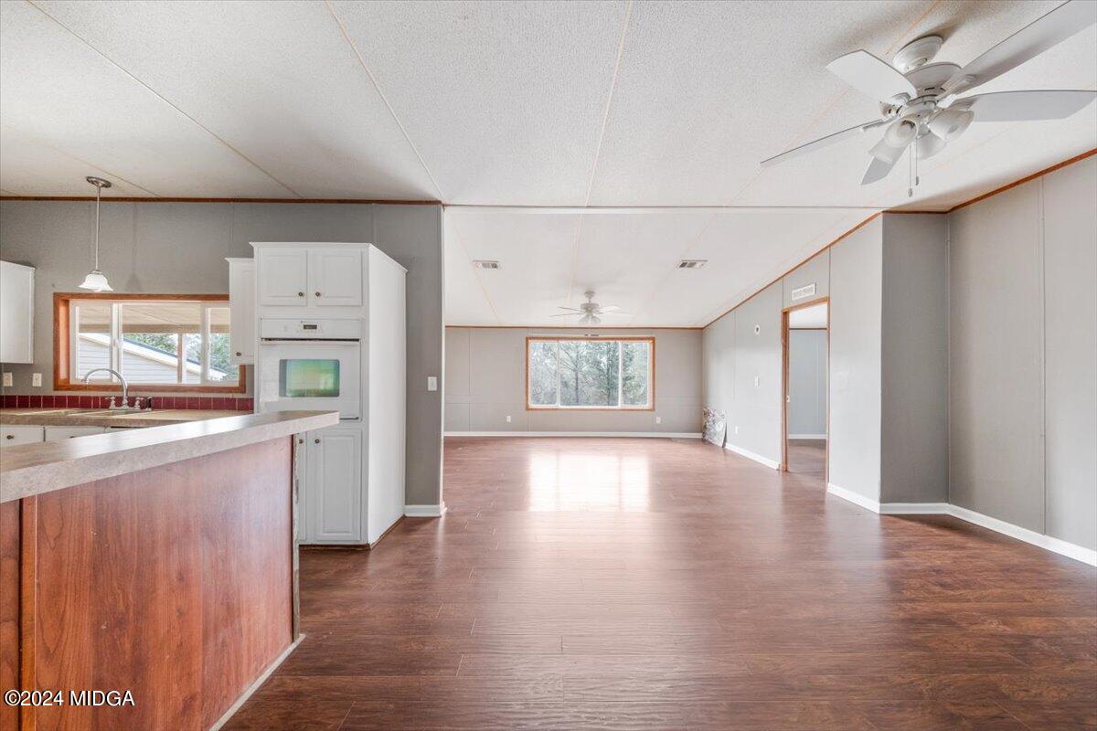 647 Gose Road Forsyth, GA 31029 - Photo 6 of 34 a view of a kitchen with a sink and a refrigerator