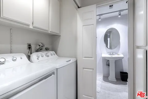 a bedroom with a bed a couch and a window