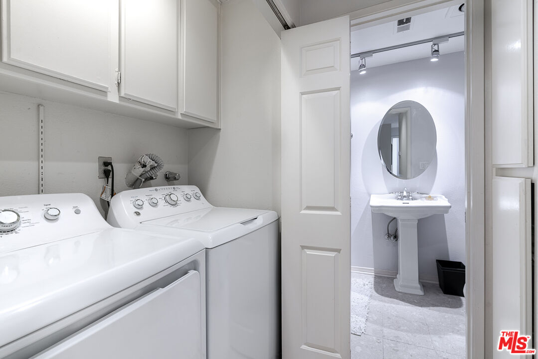 11322 Camarillo Street, Unit 201 Toluca Lake, CA 91602 - Photo 13 of 20 a utility room with dryer and washer