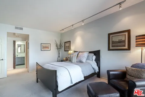 a bathroom with a sink double vanity and a mirror