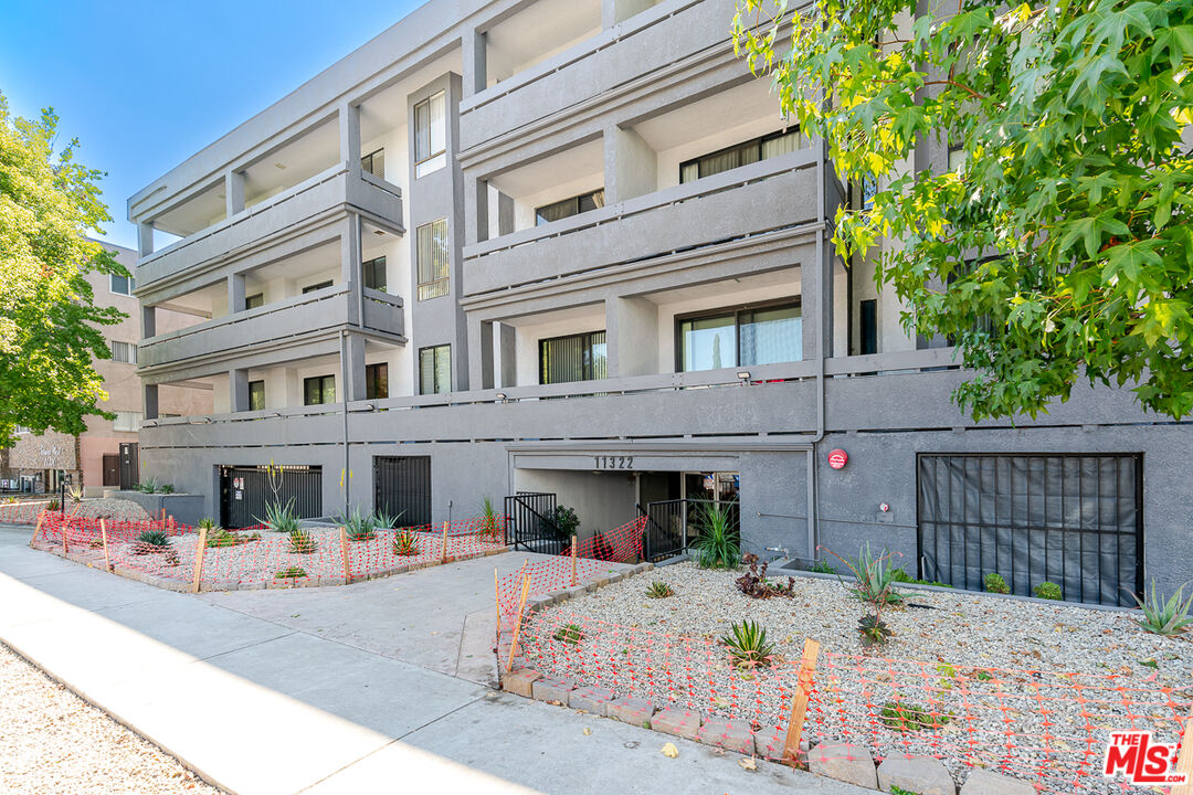 11322 Camarillo Street, Unit 201 Toluca Lake, CA 91602 - Photo 20 of 20 a view of a building with a table and chairs