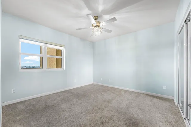 a view of an empty room with a bathroom