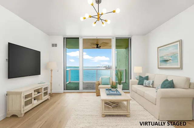 an empty room with wooden floor and door