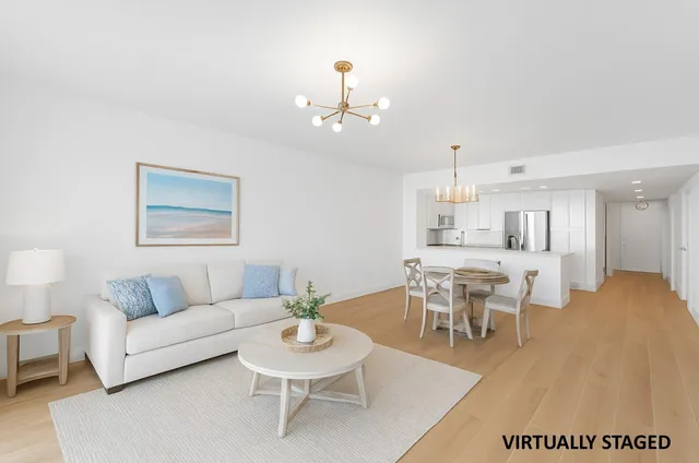a kitchen with cabinets stainless steel appliances and a sink