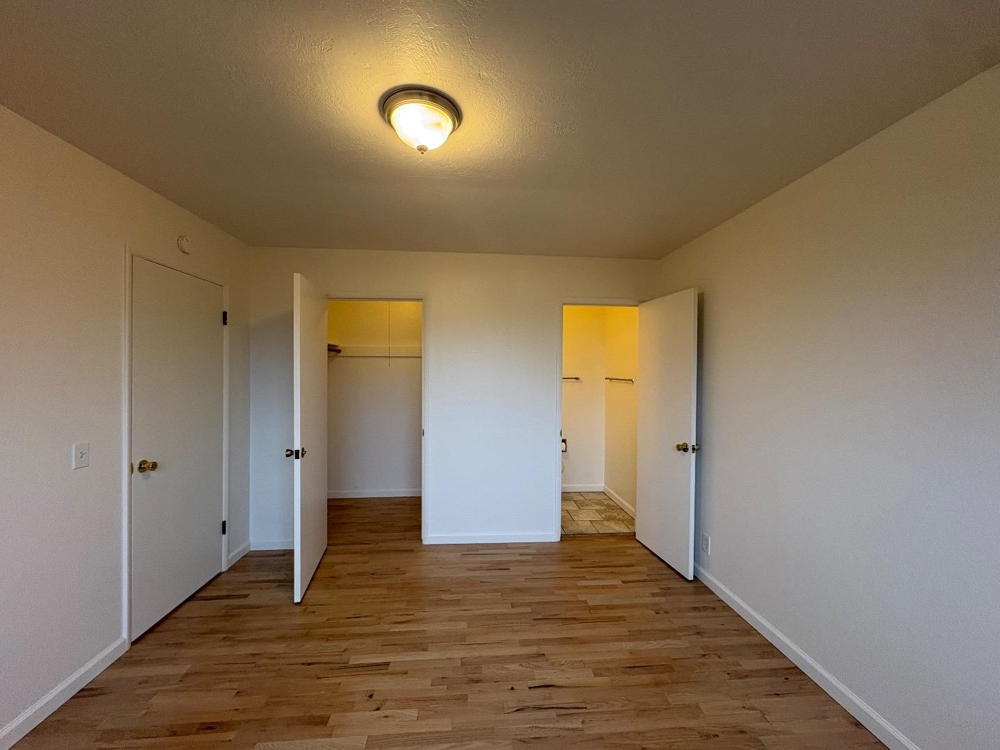 1675 Luxton Street Seaside, CA 93955 - Photo 20 of 33 a view of an empty room with wooden floor and closet