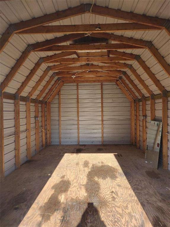 a view of backyard with garage
