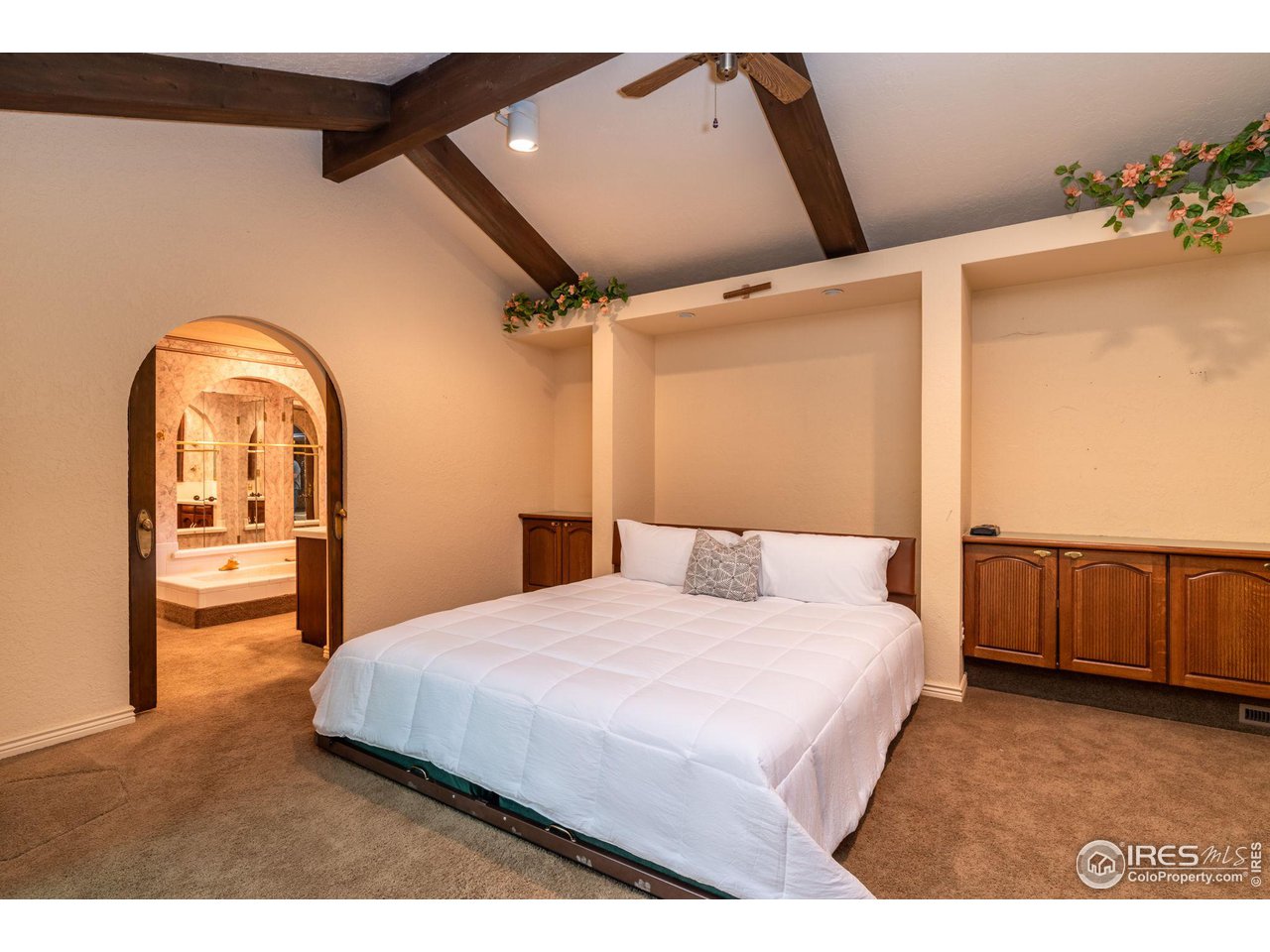 7125 Four Rivers Road Boulder, CO 80301 - Photo 23 of 40 a bedroom with a bed and a dresser