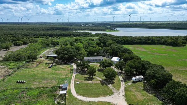 a view of a lake with a yard