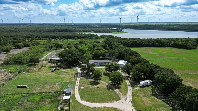 a view of a lake with a yard