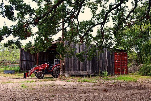 an aerial view of a houses with outdoor space