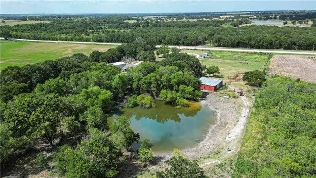 a kitchen with a table chairs stove and cabinets
