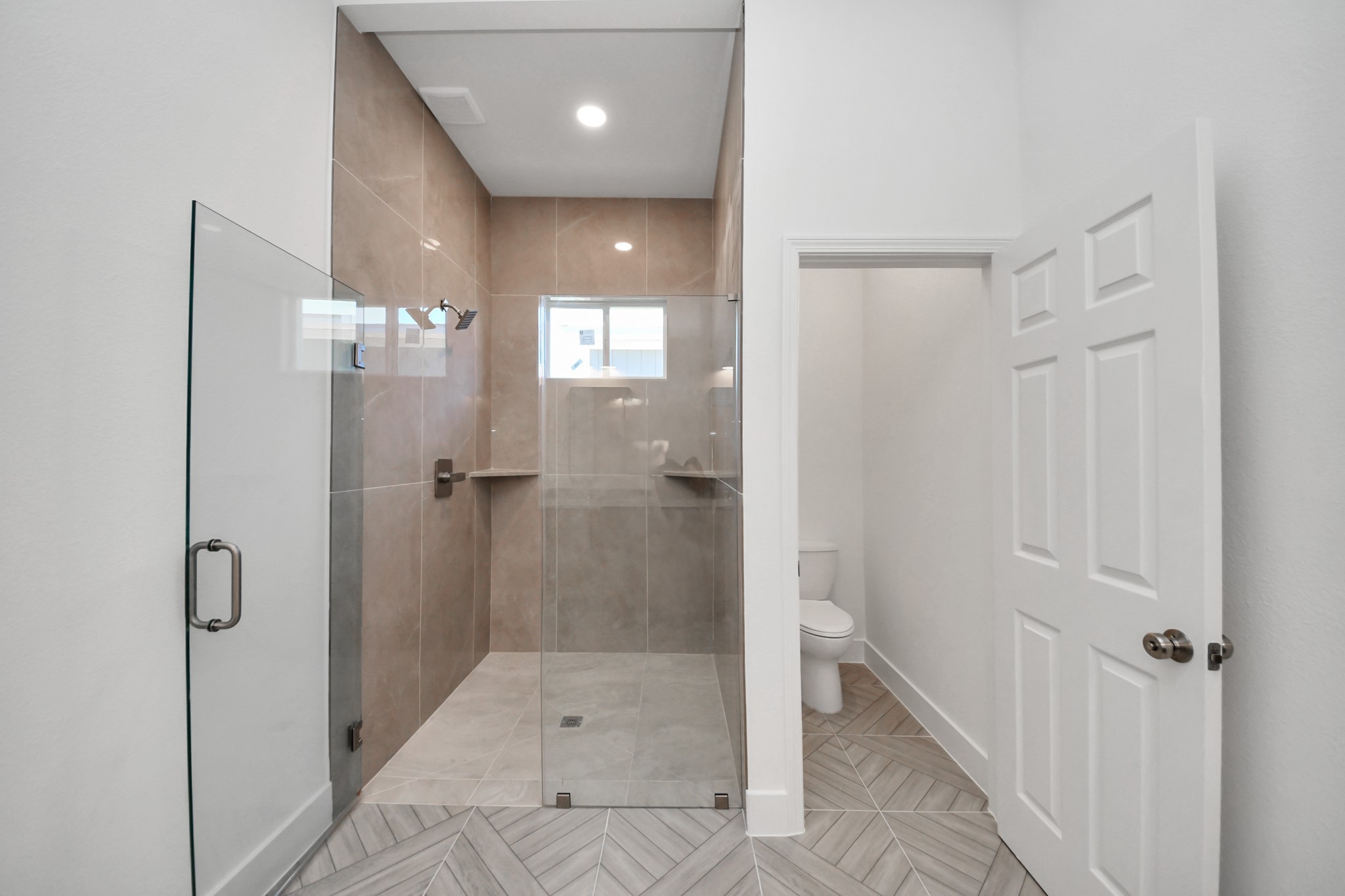 16276 Jeet Street Conroe, TX 77306 - Photo 22 of 36 a bathroom with a shower and toilet