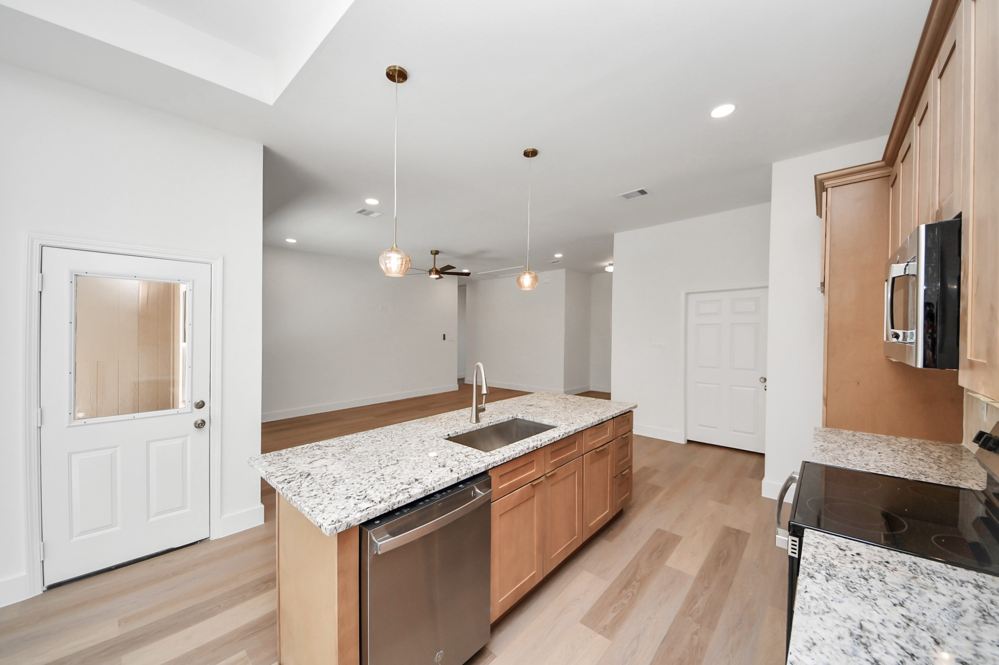 16276 Jeet Street Conroe, TX 77306 - Photo 10 of 36 a large bathroom with a granite countertop tub sink and mirror