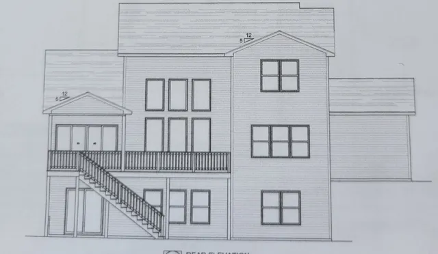 a view of staircase with white walls