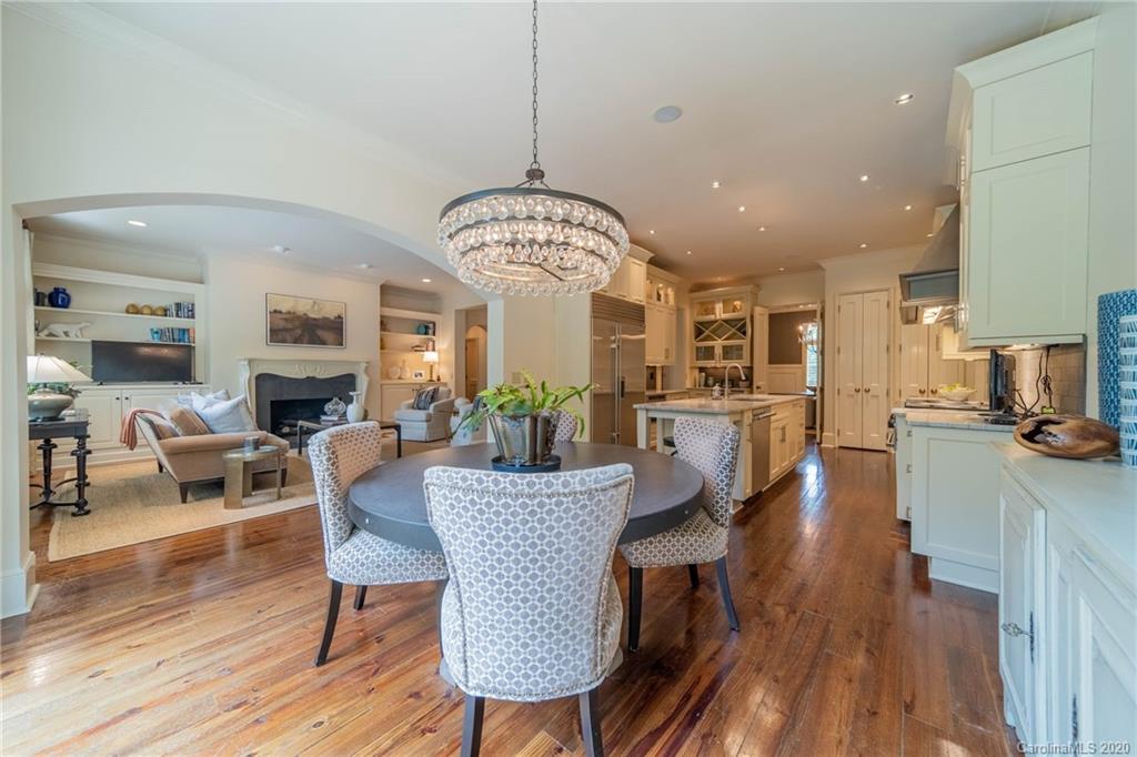 901 Colville Road Charlotte, NC 28207 - Photo 11 of 48 a view of a dining room with furniture window and wooden floor