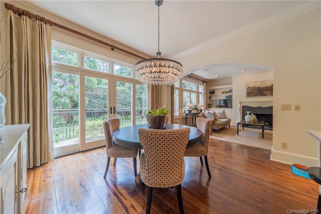 901 Colville Road Charlotte, NC 28207 - Photo 12 of 48 a view of a dining room with furniture window and wooden floor