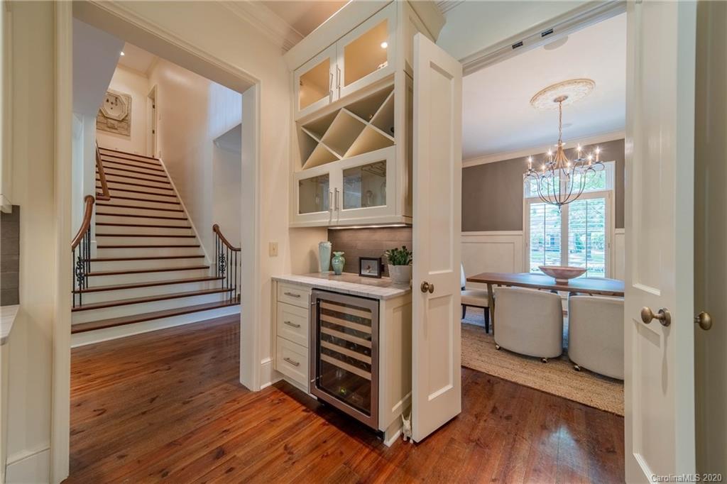 901 Colville Road Charlotte, NC 28207 - Photo 16 of 48 a kitchen with a refrigerator and a stove