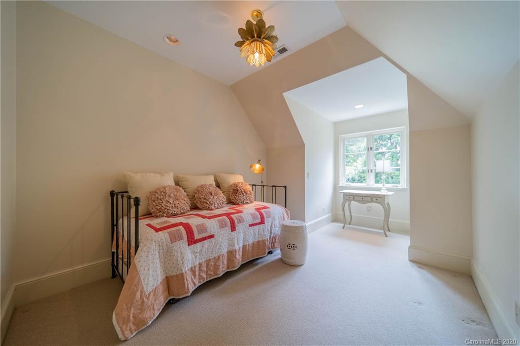 901 Colville Road Charlotte, NC 28207 - Photo 24 of 48 a bedroom with a bed and a window