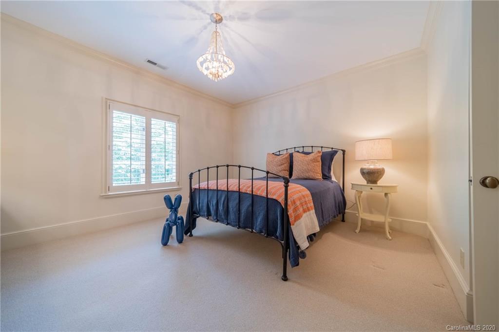 901 Colville Road Charlotte, NC 28207 - Photo 29 of 48 a bedroom with a bed and a window