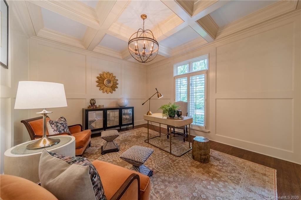 901 Colville Road Charlotte, NC 28207 - Photo 4 of 48 a living room with furniture a rug and a window