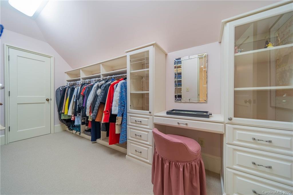 901 Colville Road Charlotte, NC 28207 - Photo 33 of 48 a view of walk in closet with clothes