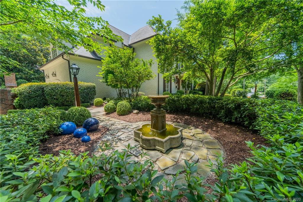 901 Colville Road Charlotte, NC 28207 - Photo 40 of 48 a view of a house with a yard and sitting area