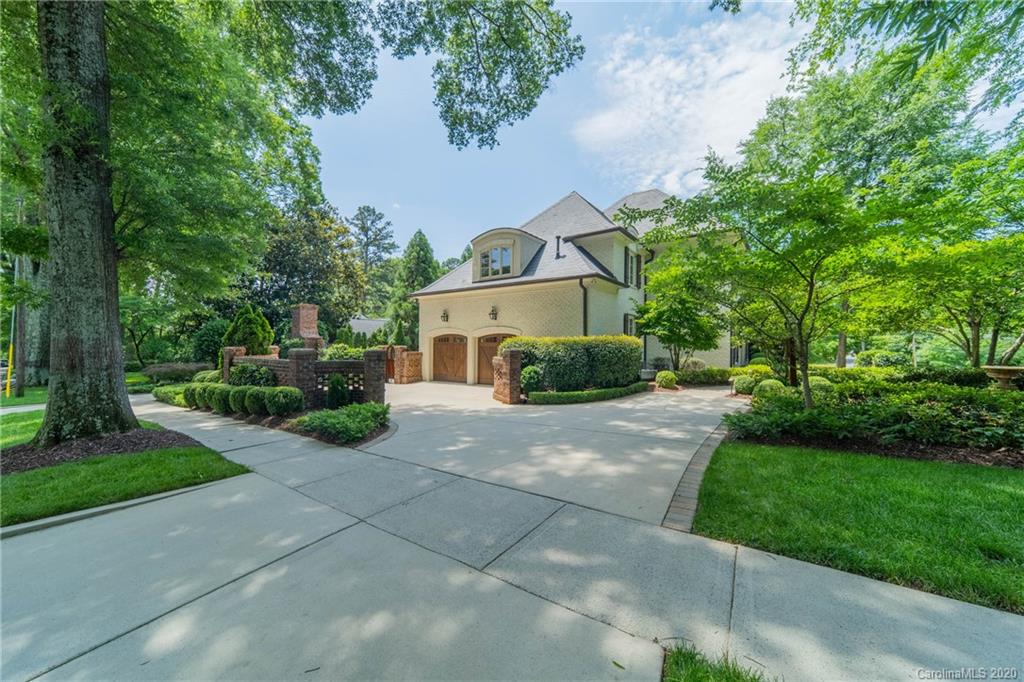 901 Colville Road Charlotte, NC 28207 - Photo 41 of 48 a front view of a house with a yard and a garden