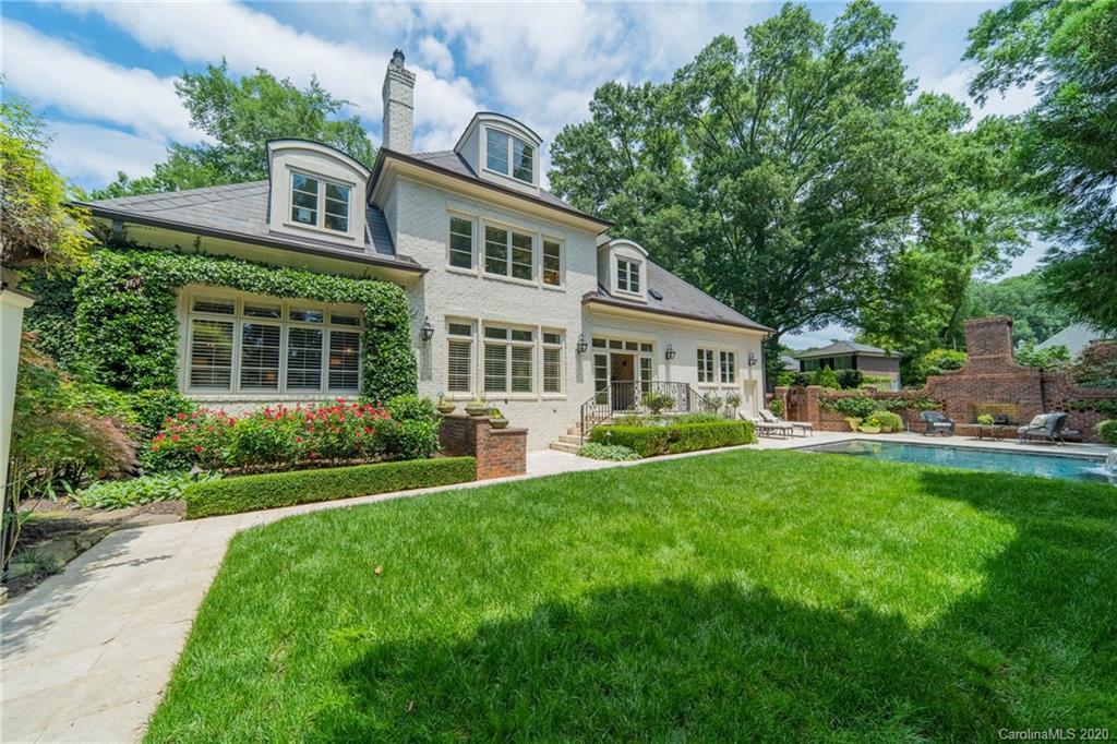 901 Colville Road Charlotte, NC 28207 - Photo 44 of 48 a front view of a house with a yard table and chairs