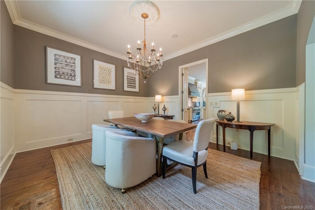 901 Colville Road Charlotte, NC 28207 - Photo 6 of 48 a view of a dining room with furniture and wooden floor