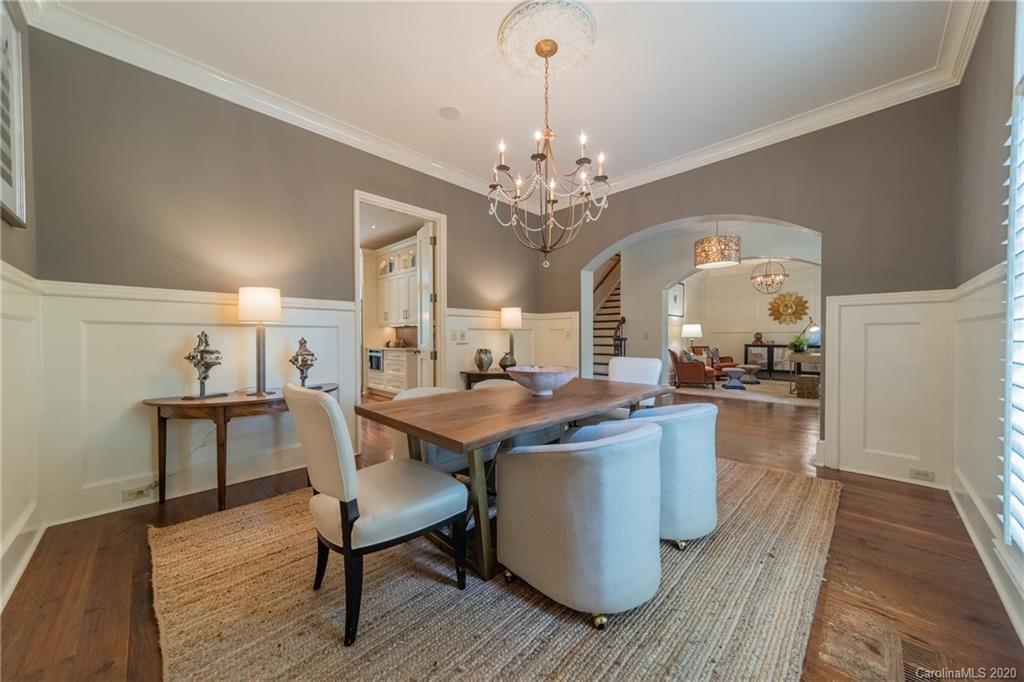 901 Colville Road Charlotte, NC 28207 - Photo 7 of 48 a view of a dining room with furniture and wooden floor