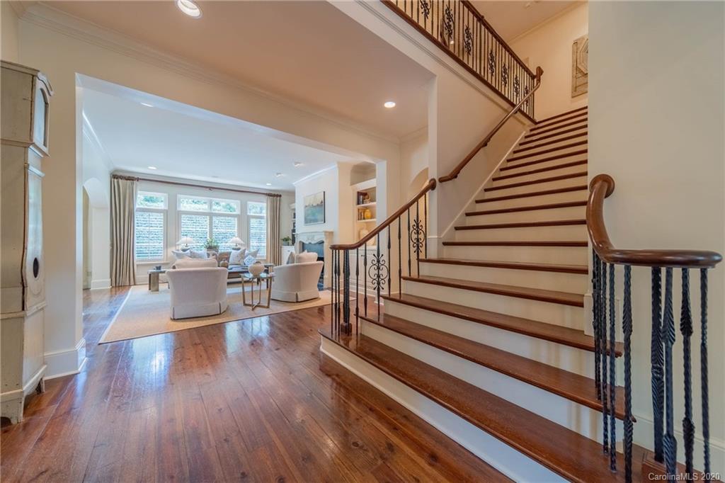901 Colville Road Charlotte, NC 28207 - Photo 8 of 48 a living room with wooden floor furniture and a potted plant