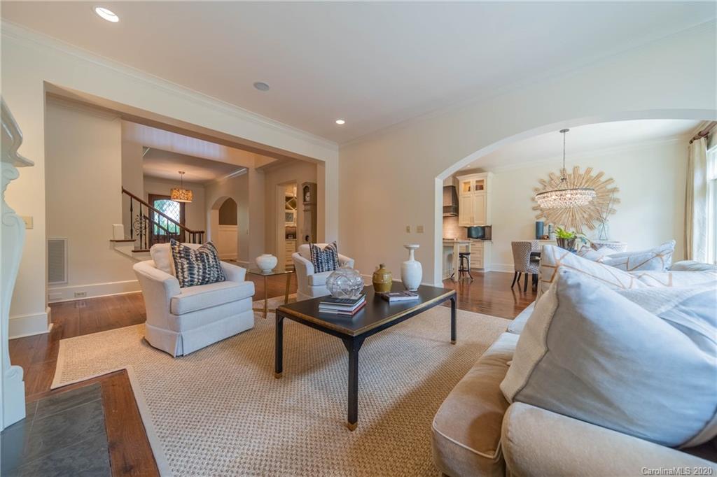 901 Colville Road Charlotte, NC 28207 - Photo 10 of 48 a living room with furniture and a chandelier