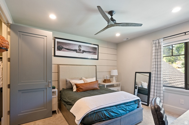 3 Carriagewood Cove, Unit 1088 Sandy, UT 84092 - Photo 35 of 79 Recessed lighting and ceiling fan in a room featuring a window with black trim, a paneled accent wall, and a two-panel interior door