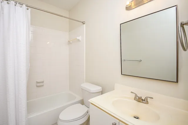a kitchen with granite countertop cabinets stainless steel appliances and a sink